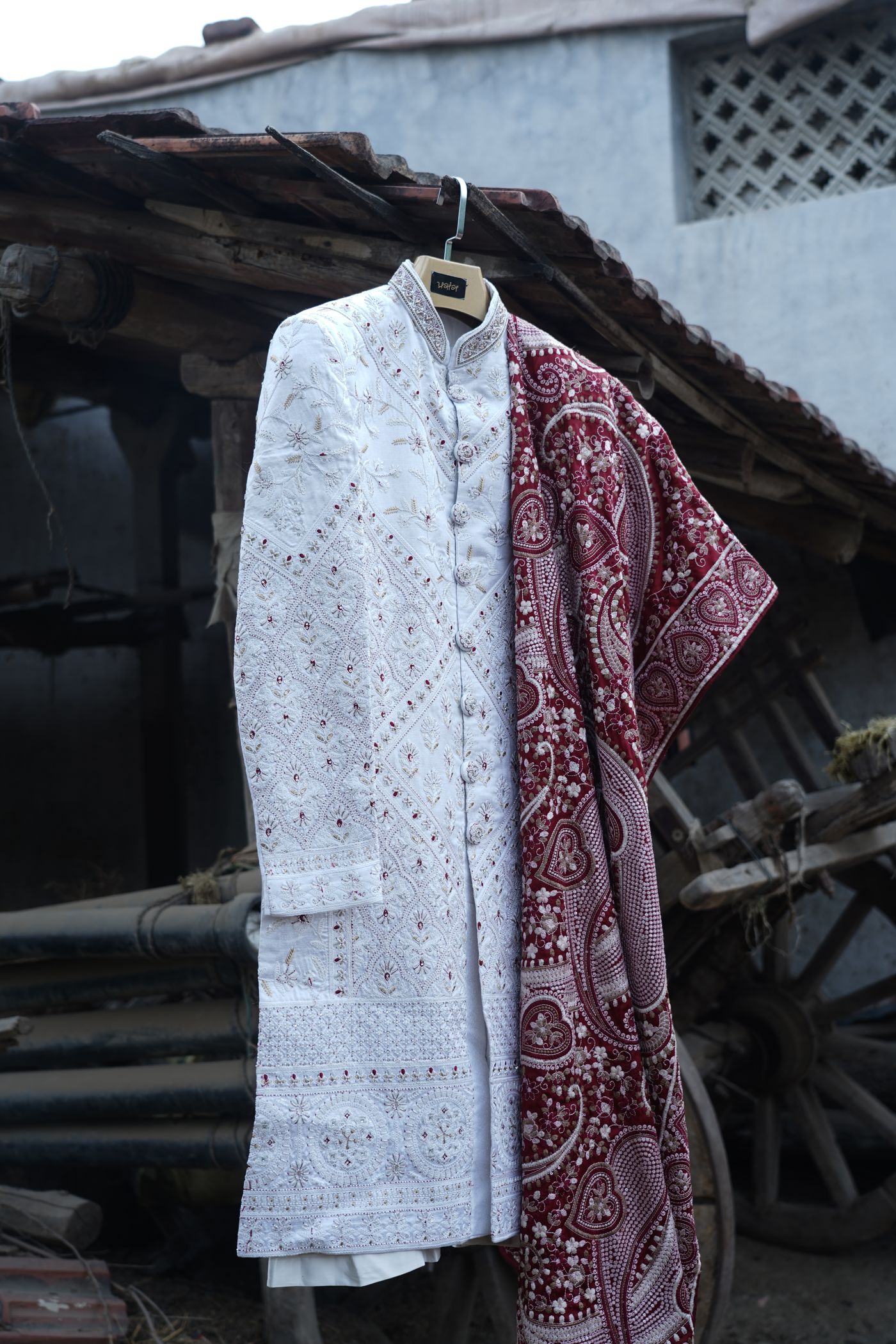 White chikankari groom sherwani with maroon embroidered dupatta